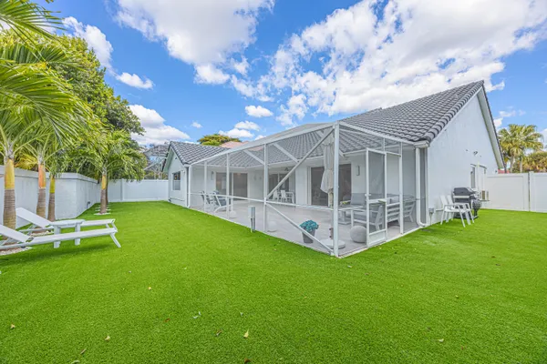 a view of a house with a yard porch and sitting area