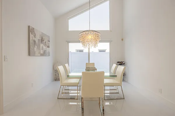a dining room with furniture and window