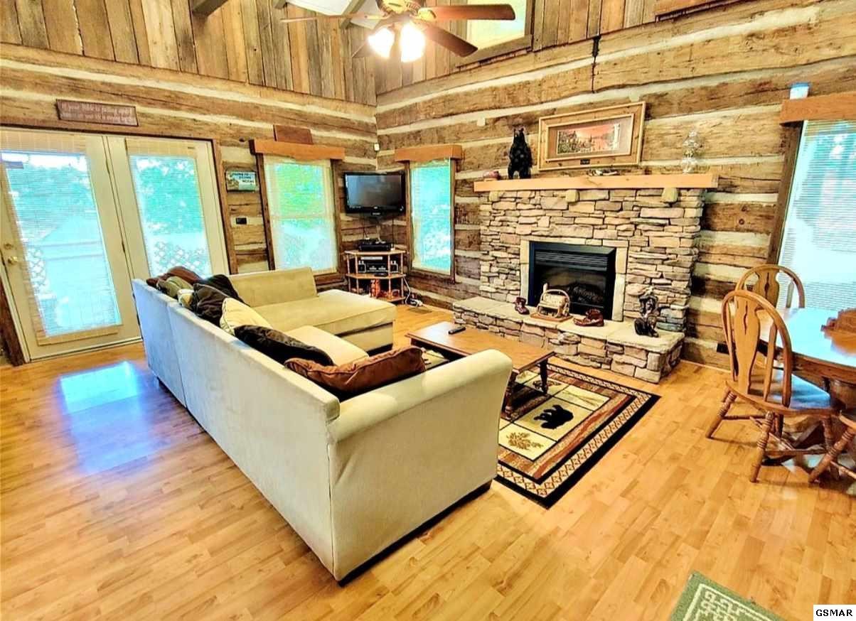 2124 Key Way Sevierville, TN 37876 - Photo 4 of 29 a living room with furniture pool table and a fireplace