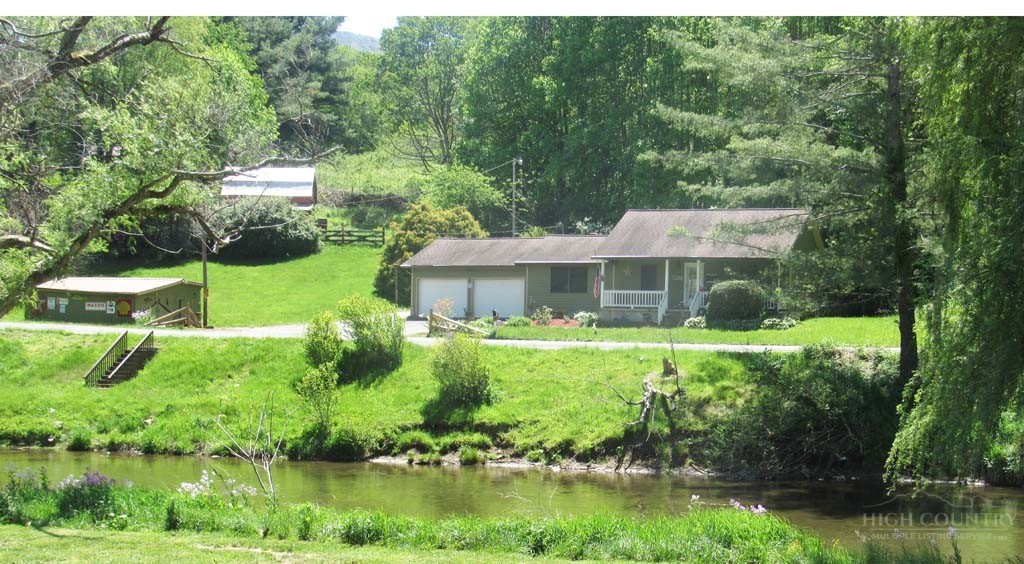 805 Ed Little Road Warrensville, NC 28693 - Photo 1 of 49 a front view of house with yard and green space