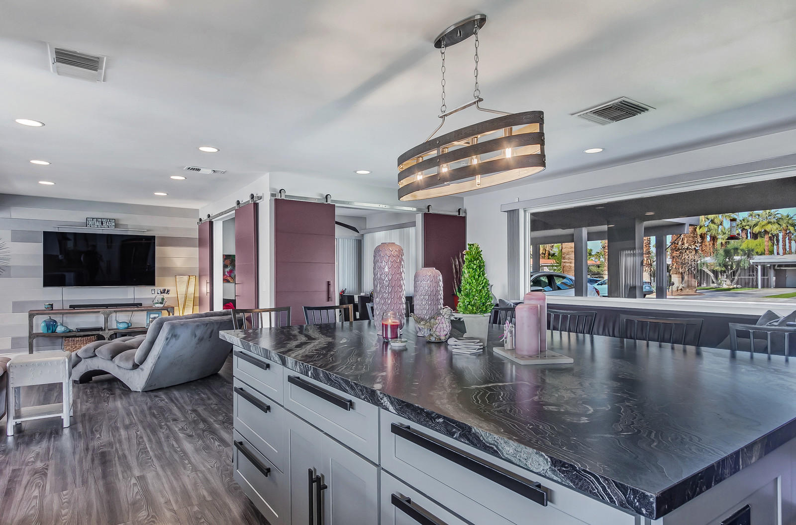 70061 Chappel Road Rancho Mirage, CA 92270 - Photo 11 of 26 a kitchen with stainless steel appliances granite countertop a sink a stove and a view of living room