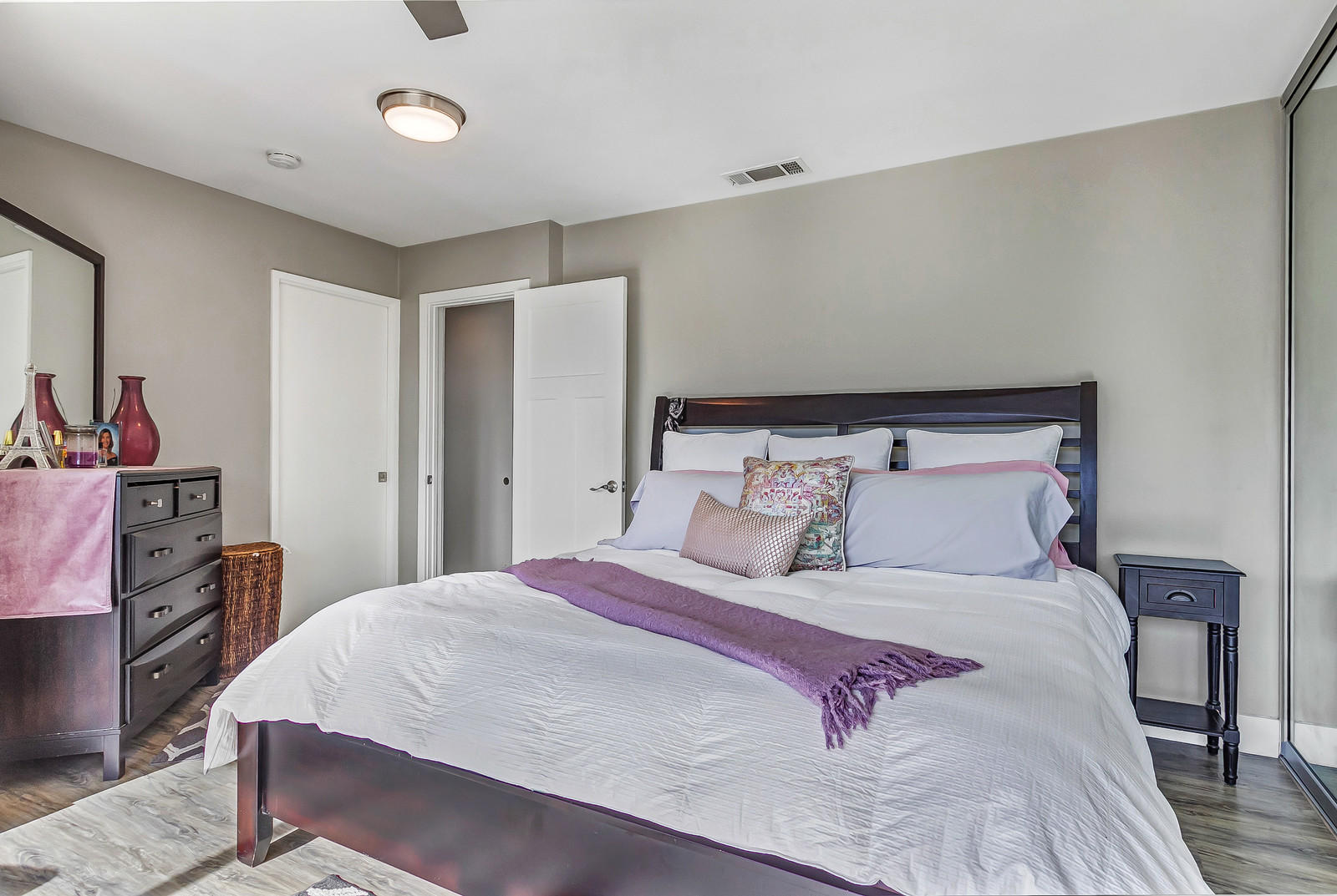 70061 Chappel Road Rancho Mirage, CA 92270 - Photo 13 of 26 a bedroom with a large bed and a flat tv screen on dresser