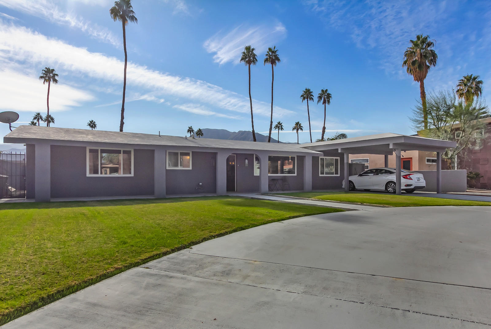 70061 Chappel Road Rancho Mirage, CA 92270 - Photo 3 of 26 a front view of a house with a yard