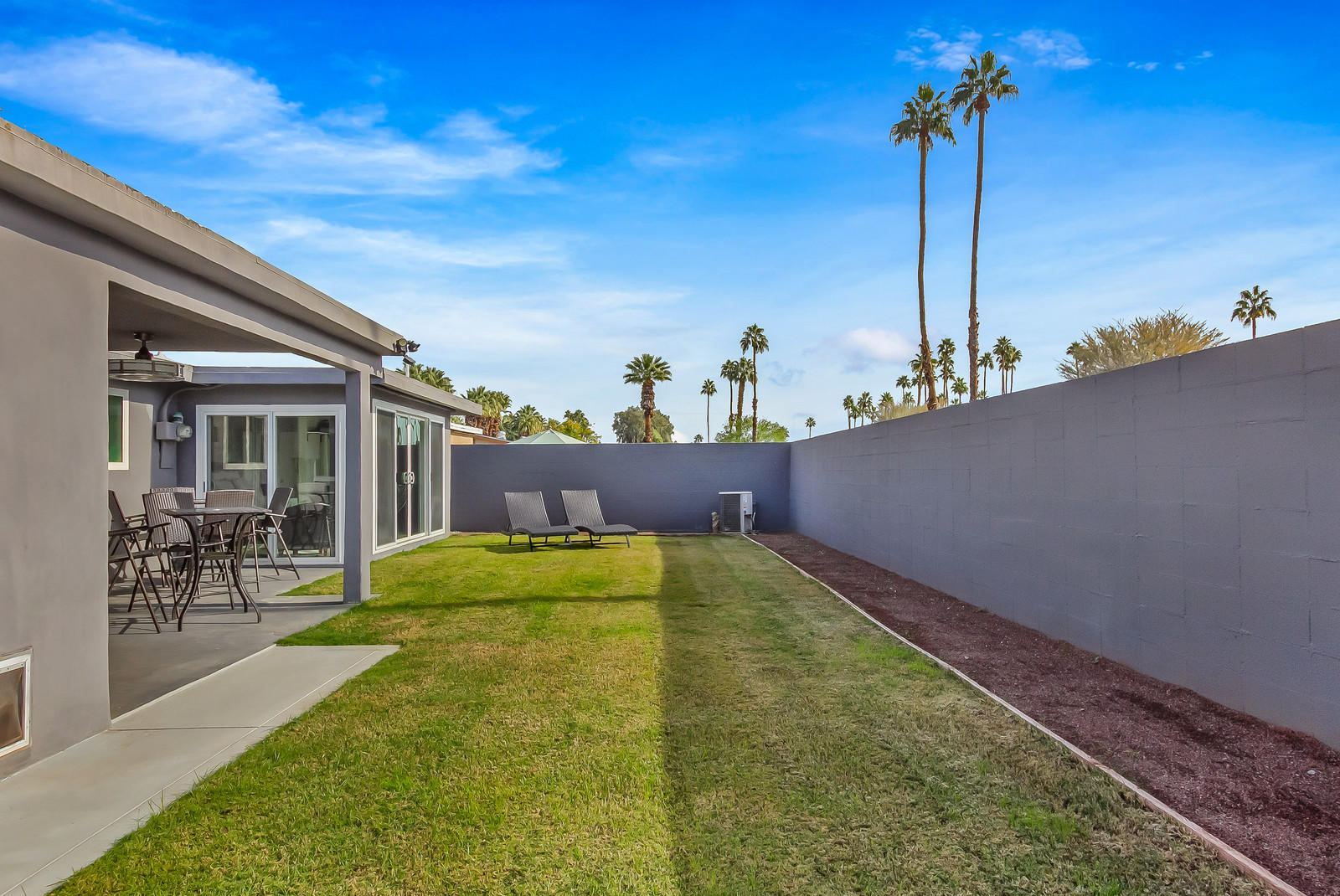 70061 Chappel Road Rancho Mirage, CA 92270 - Photo 23 of 26 a view of a terrace with a table and chairs