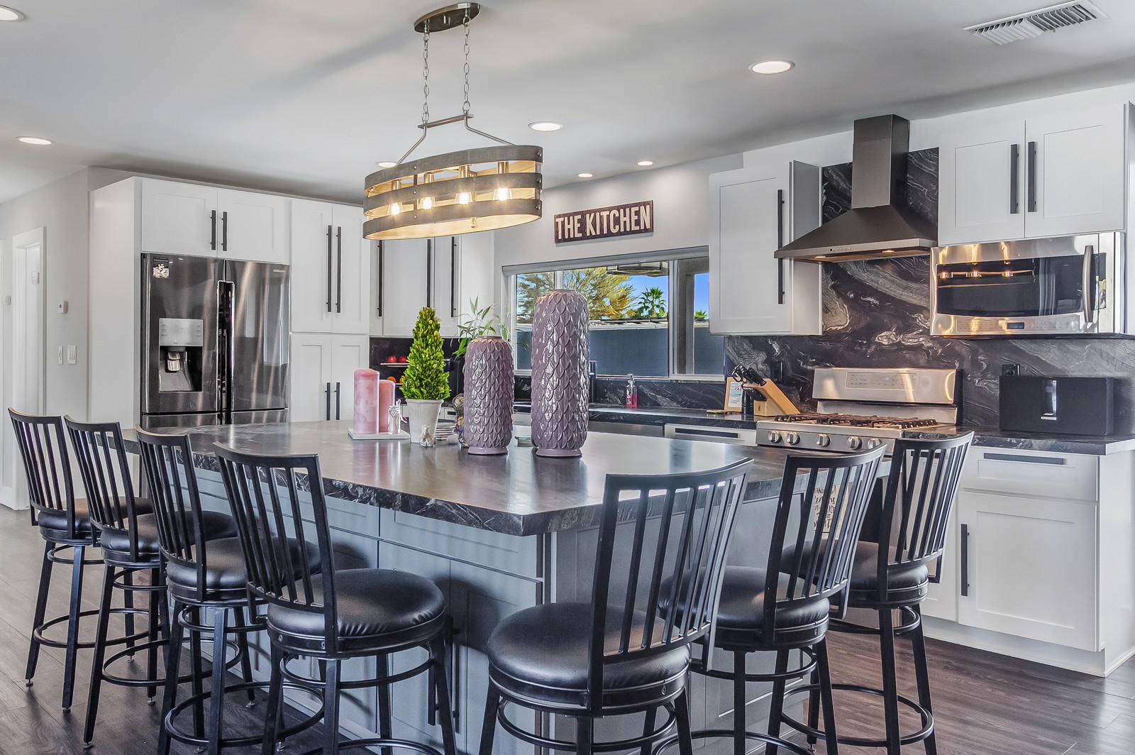 70061 Chappel Road Rancho Mirage, CA 92270 - Photo 8 of 26 a view of a dining room with furniture wooden floor and chandelier