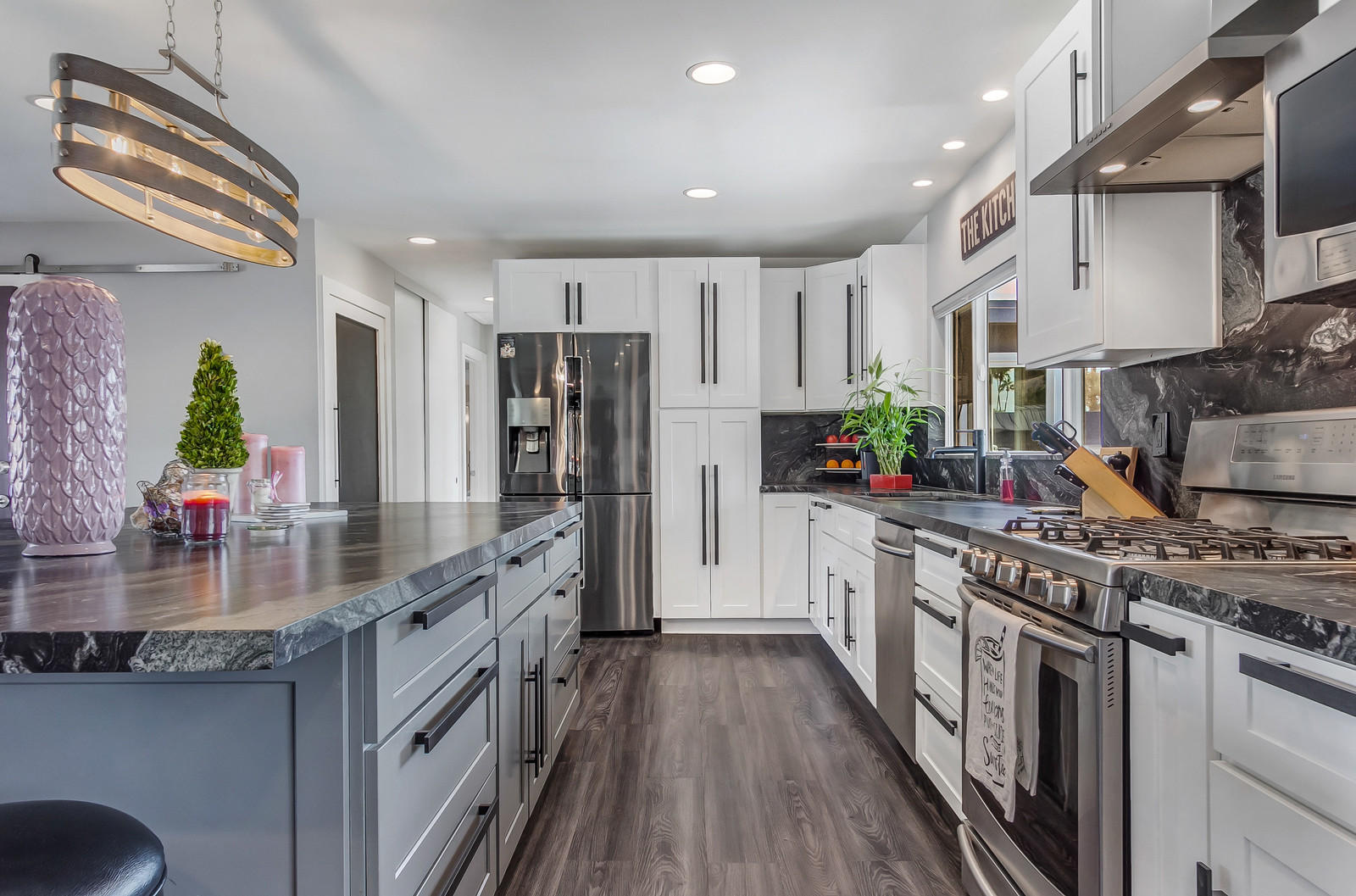 70061 Chappel Road Rancho Mirage, CA 92270 - Photo 9 of 26 a kitchen with stainless steel appliances granite countertop a stove a sink dishwasher a refrigerator and a oven