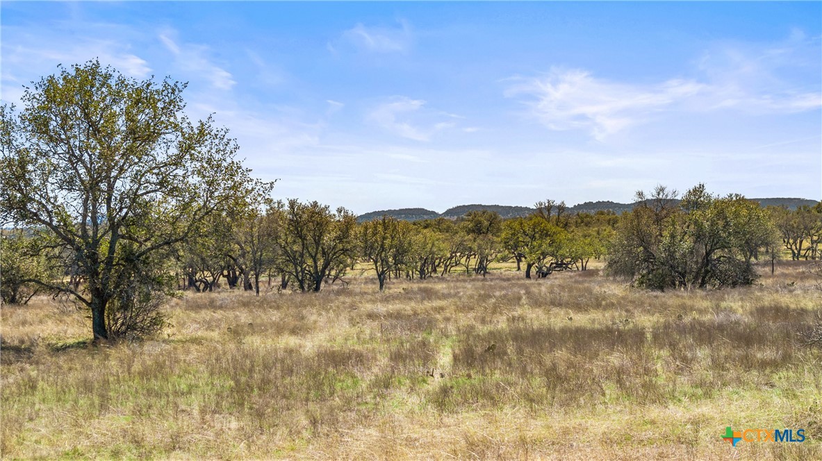 a view of mountain with mountain in the background