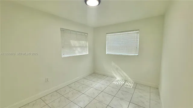 a view of an empty room with window