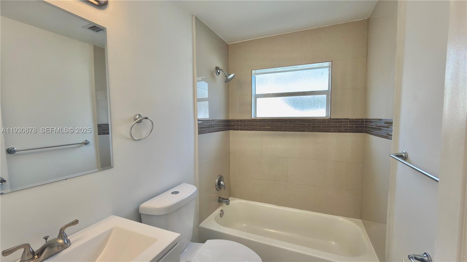 6504 Arbor Drive, Unit 6504 Miramar, FL 33023 - Photo 17 of 31 a bathroom with a toilet and a bathtub