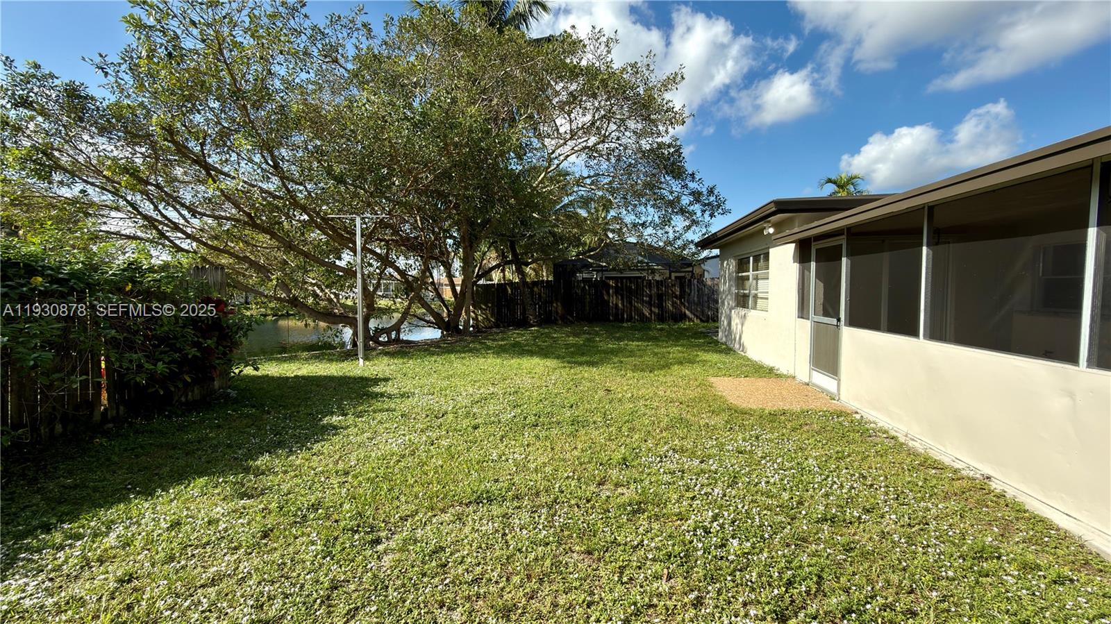 6504 Arbor Drive, Unit 6504 Miramar, FL 33023 - Photo 27 of 31 a view of a backyard with large trees
