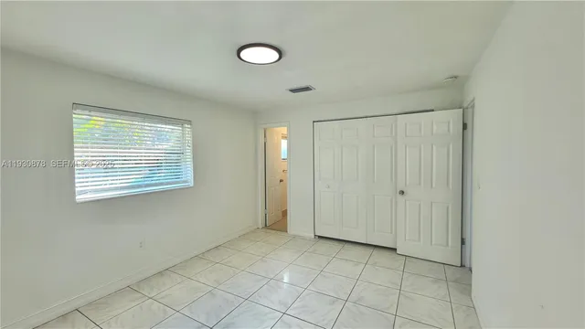 a view of an empty room with window