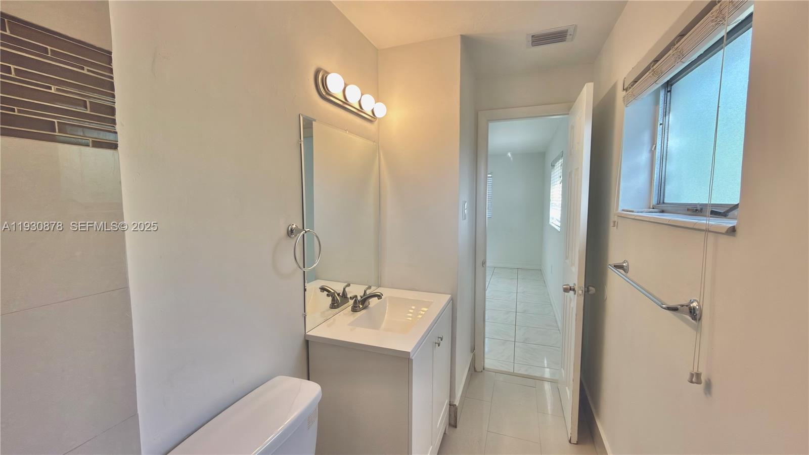 6504 Arbor Drive, Unit 6504 Miramar, FL 33023 - Photo 9 of 31 a bathroom with a sink a toilet and shower