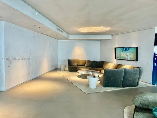 a view of a dining room with furniture and window