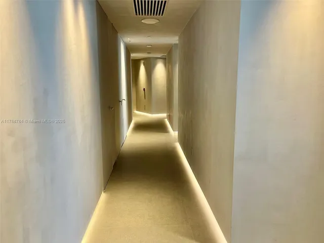 a bedroom with a bed and a potted plant