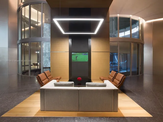 a view of an empty room with floor to ceiling window and an entryway