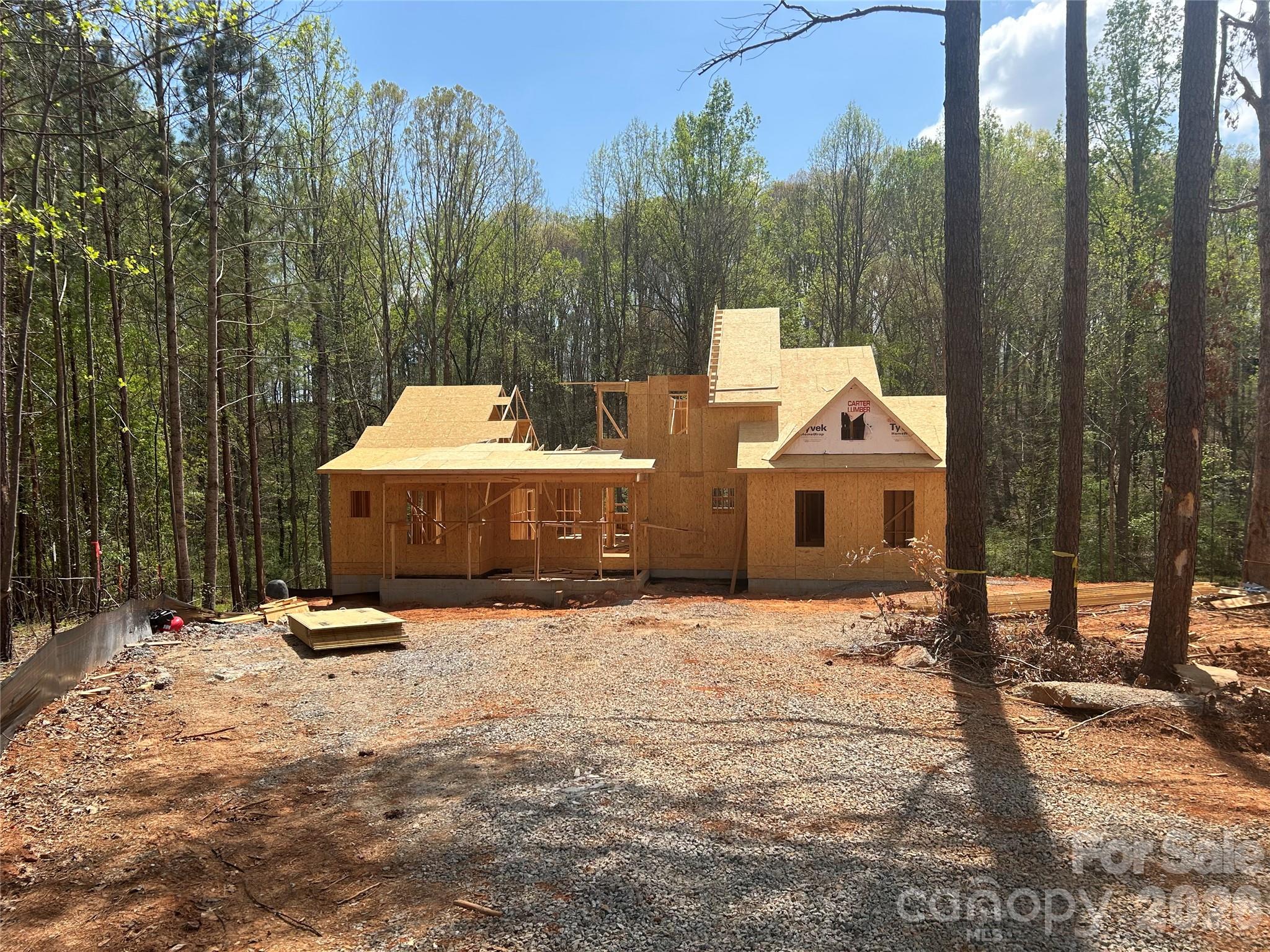 7246 Windy Ridge Drive Iron Station, NC 28080 - Photo 2 of 9 a view of the patio with a bench