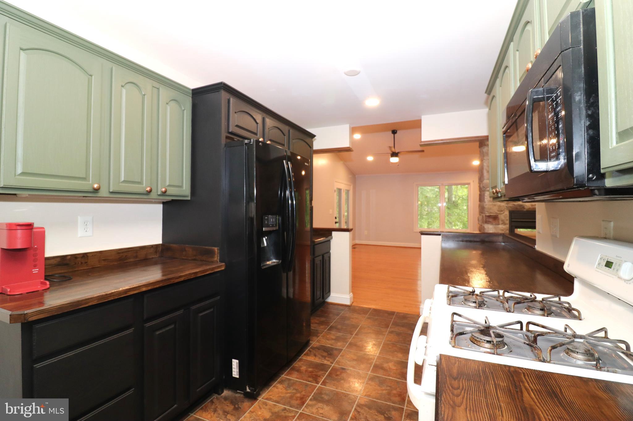 1111 Eastover Parkway Locust Grove, VA 22508 - Photo 16 of 62 a kitchen with stainless steel appliances granite countertop a refrigerator and a stove