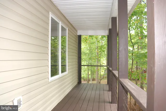 a view of a hallway with a window