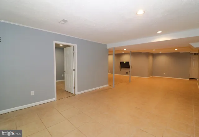 a view of a room with wooden door