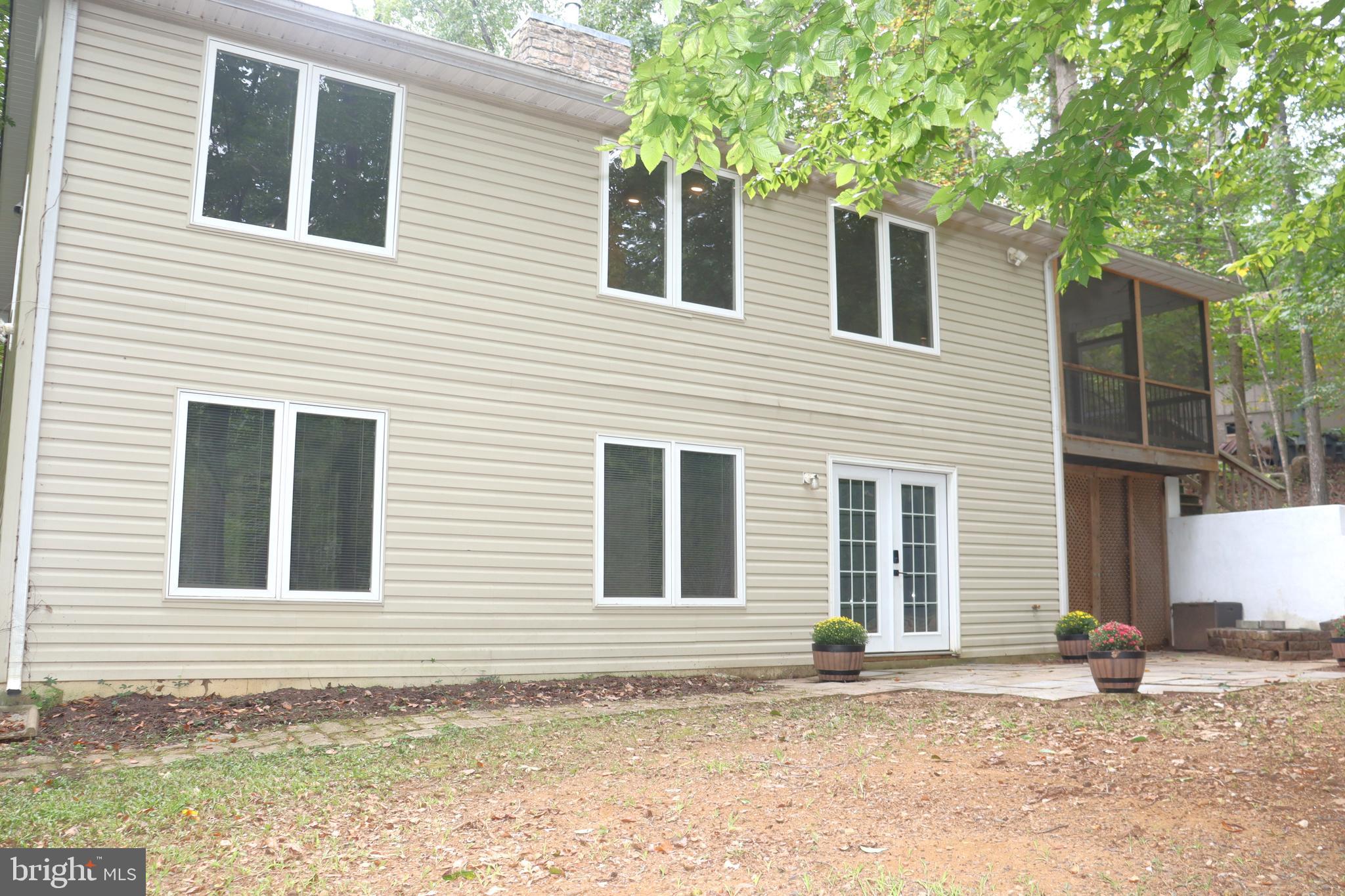 1111 Eastover Parkway Locust Grove, VA 22508 - Photo 50 of 62 a house with trees in front of it