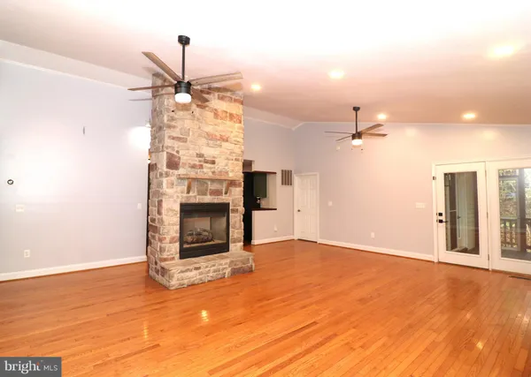 a view of a porch with wooden floor