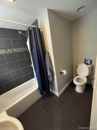 1029 Beekman Road, Unit 4 Hopewell Junction, NY 12533 - Photo 7 of 9 a bathroom with a sink and a mirror