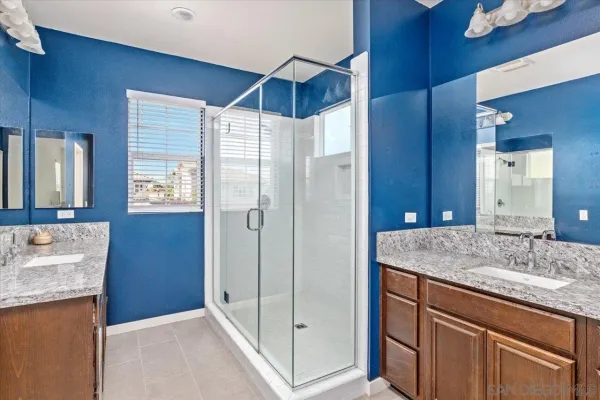 a bathroom with a sink vanity and a mirror