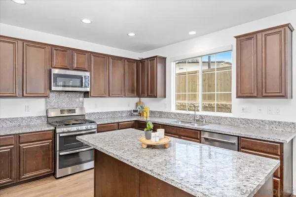 a kitchen with granite countertop lots of counter top space