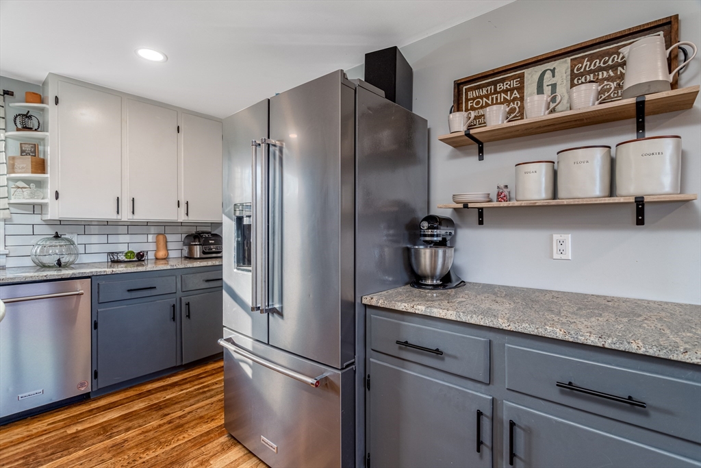 319 Chase Road Lunenburg, MA 01462 - Photo 14 of 26 a kitchen with stainless steel appliances granite countertop a refrigerator and a sink