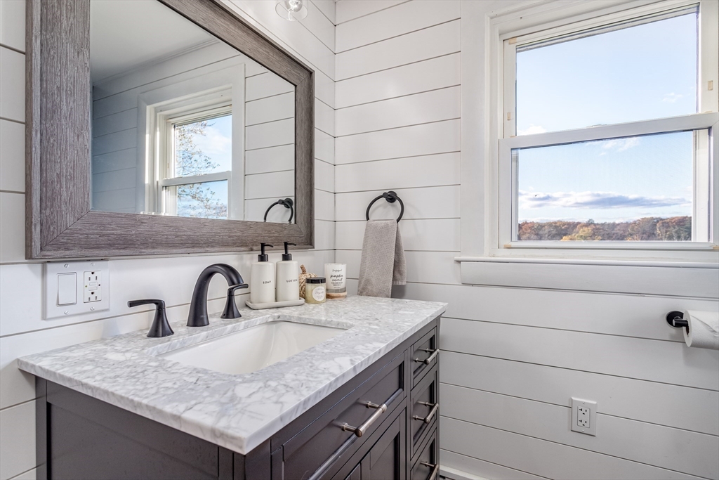319 Chase Road Lunenburg, MA 01462 - Photo 17 of 26 a bathroom with a sink and a mirror
