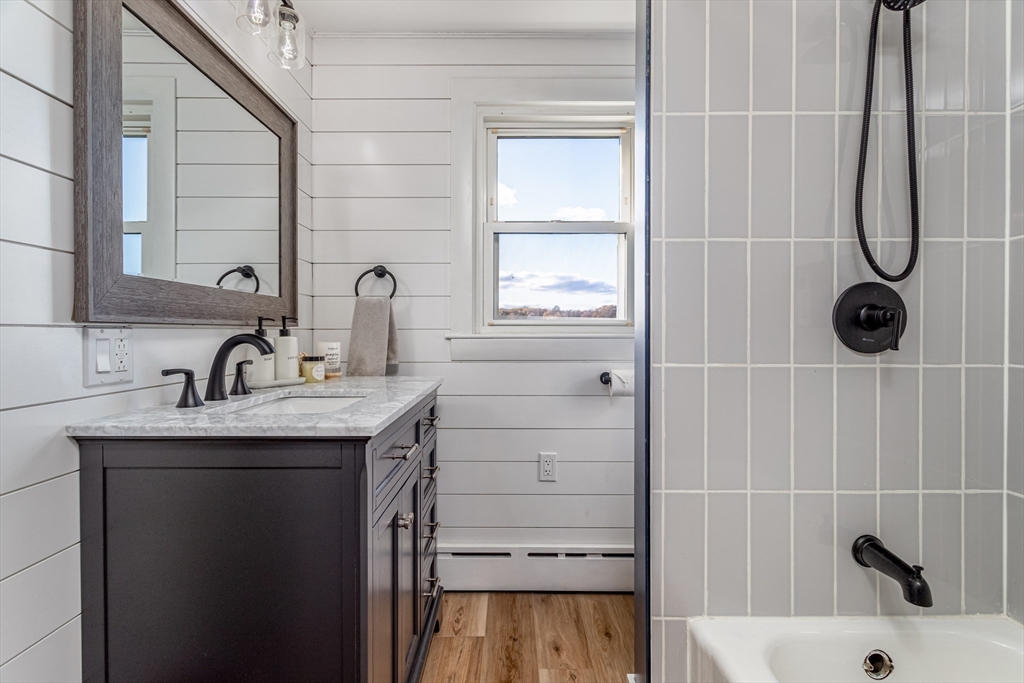 319 Chase Road Lunenburg, MA 01462 - Photo 18 of 26 a bathroom with a sink and a mirror