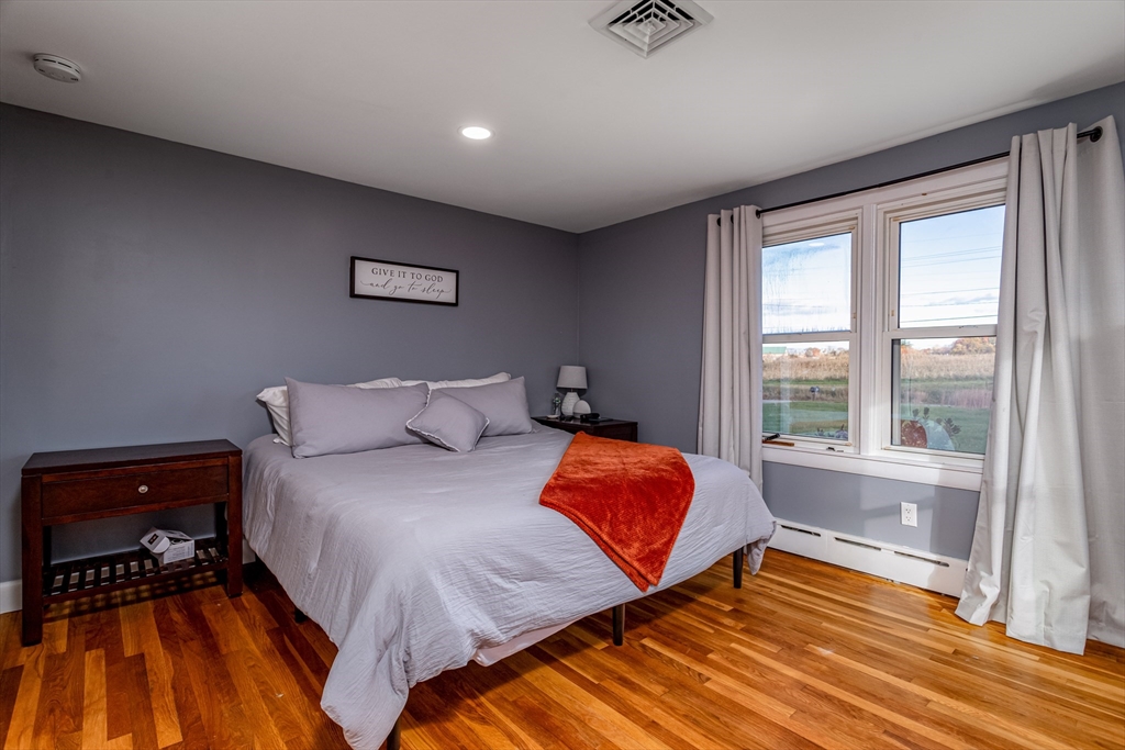 319 Chase Road Lunenburg, MA 01462 - Photo 20 of 26 a bedroom with a bed and a window