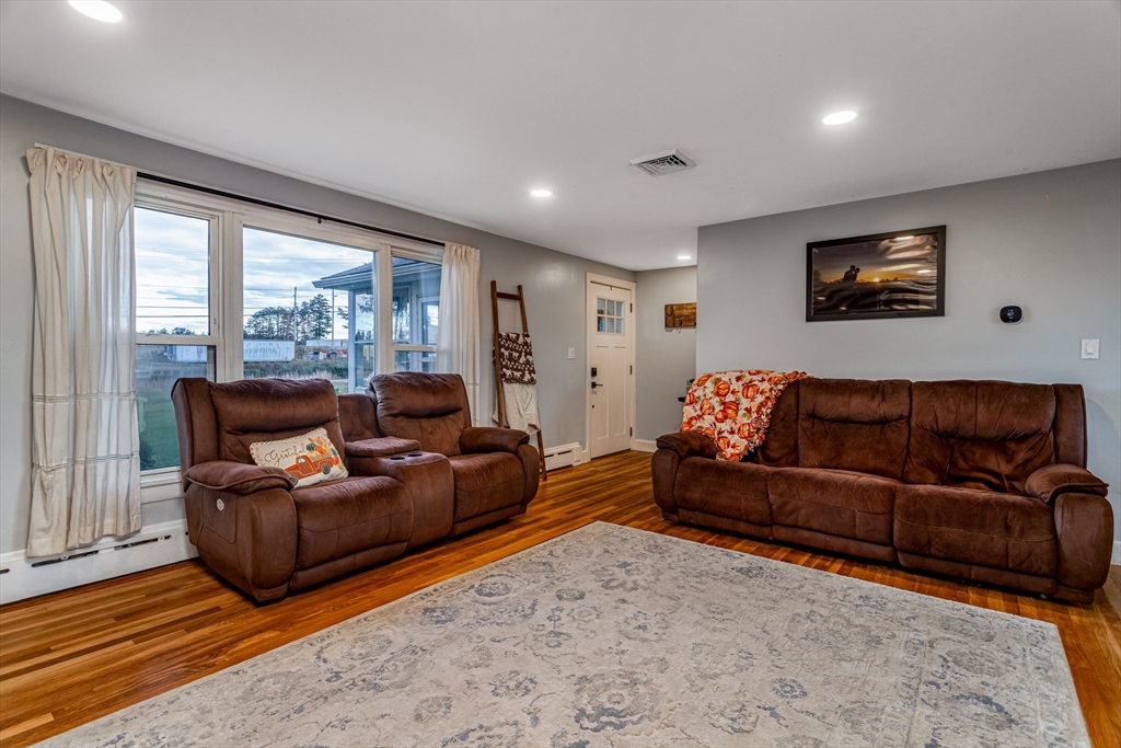 319 Chase Road Lunenburg, MA 01462 - Photo 10 of 26 a living room with furniture and a large window