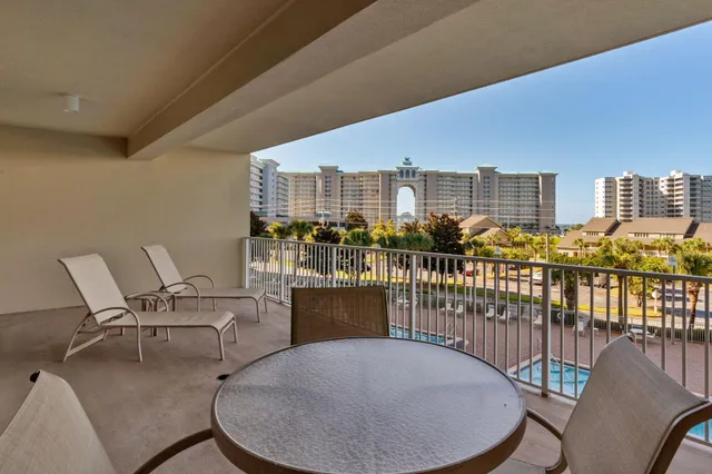 a view of a balcony with chairs