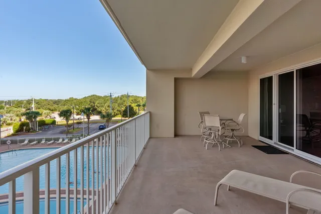 a view of a chairs and table in patio