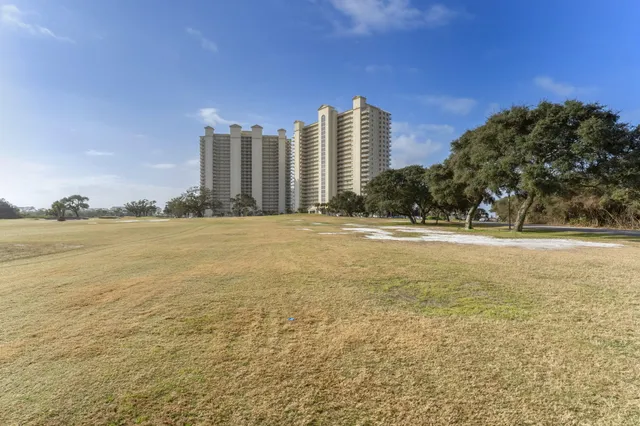 a view of an ocean with a multi story building