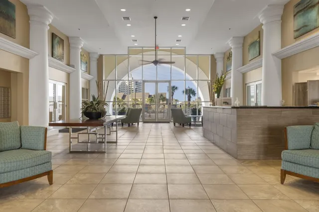a view of a living room kitchen and a windows
