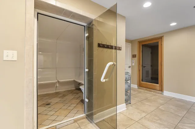 a bathroom with a shower and a sink