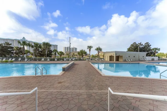 a view of swimming pool with a yard