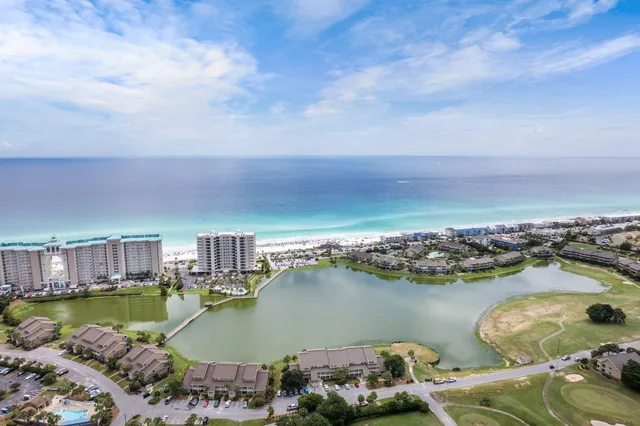 an aerial view of a houses with swimming pool and outdoor space