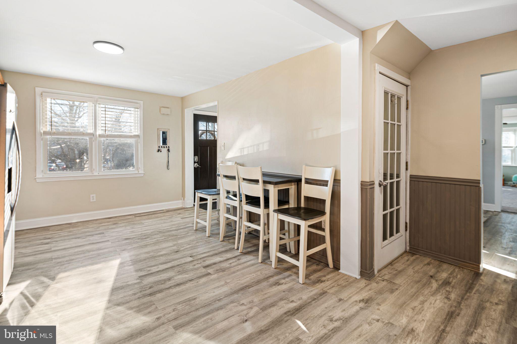 273 Hopkins Road Haddonfield, NJ 08033 - Photo 12 of 35 an empty room with wooden floor and windows