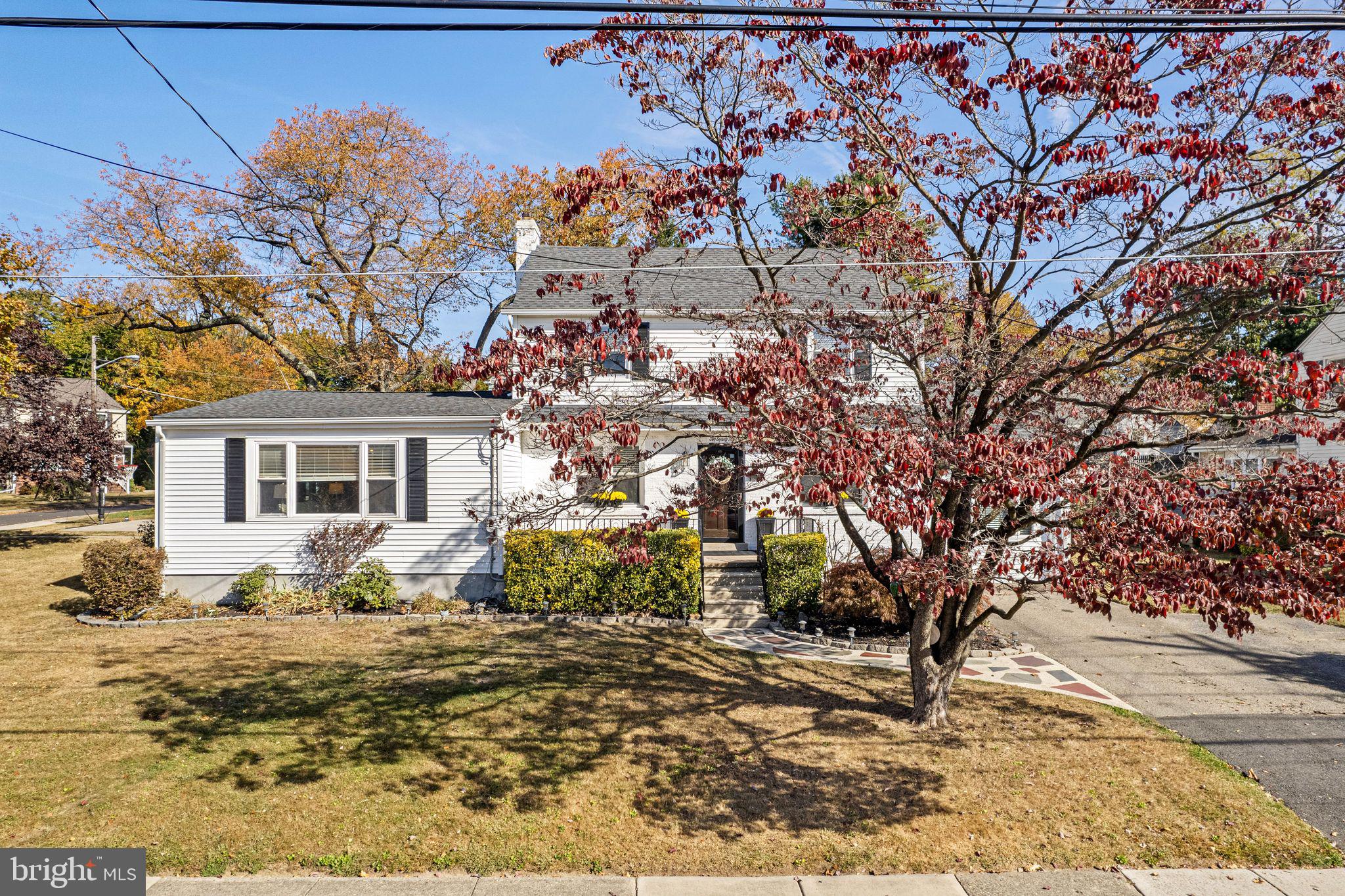 273 Hopkins Road Haddonfield, NJ 08033 - Photo 35 of 35 a front view of a house with a yard covered with snow