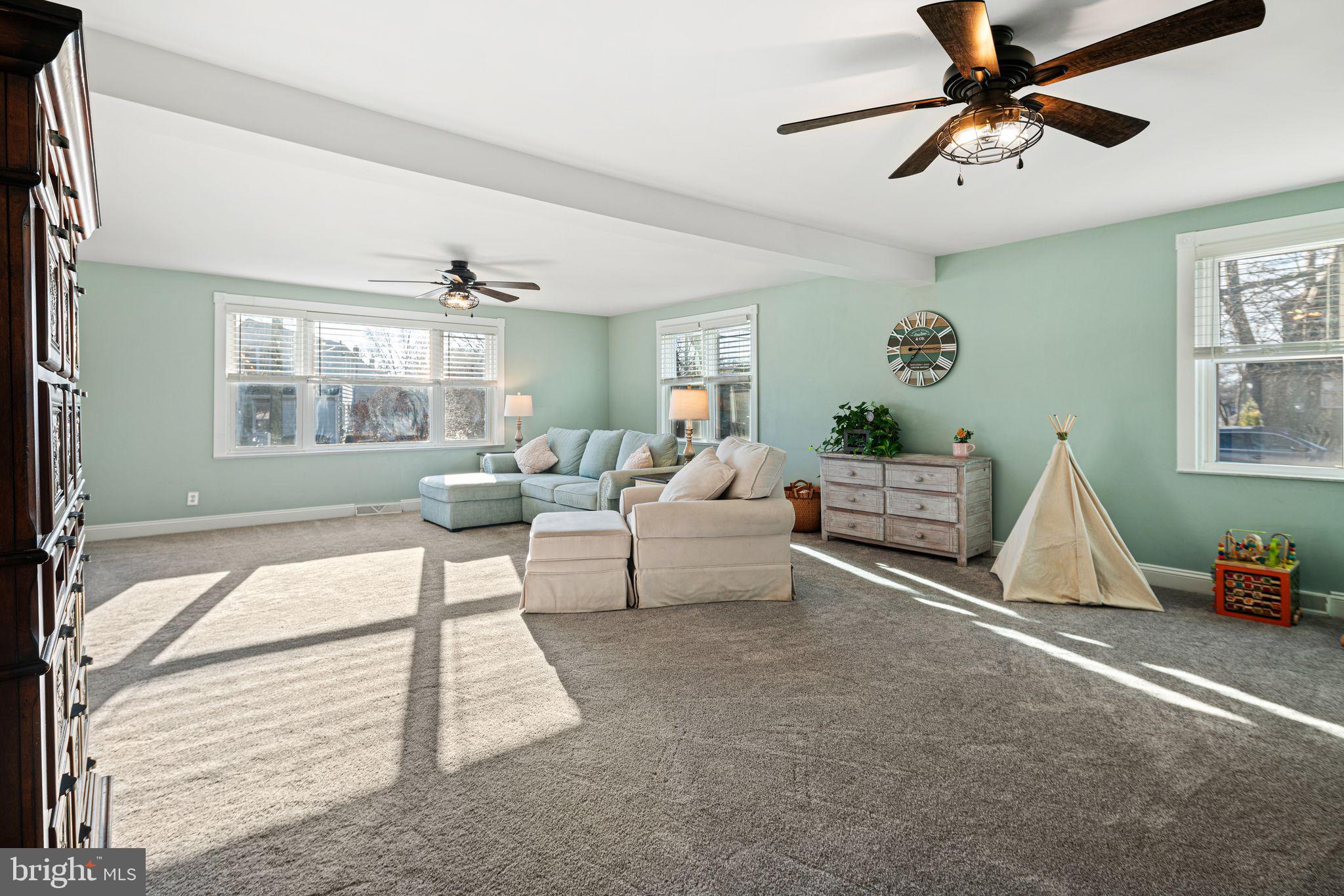 273 Hopkins Road Haddonfield, NJ 08033 - Photo 8 of 35 a living room with furniture and a chandelier