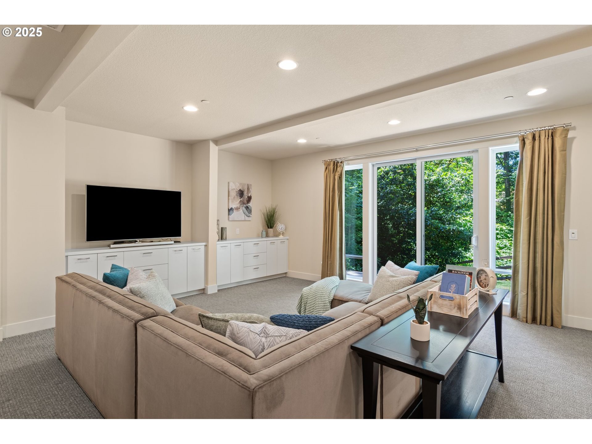 3425 Southwest 57th Avenue Portland, OR 97221 - Photo 14 of 33 a living room with furniture and a flat screen tv