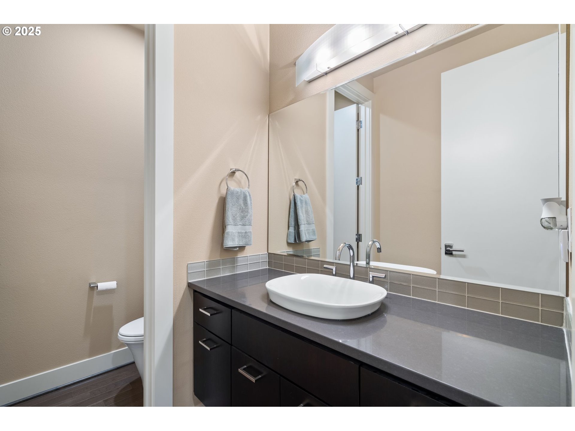 3425 Southwest 57th Avenue Portland, OR 97221 - Photo 17 of 33 a bathroom with a sink and a mirror