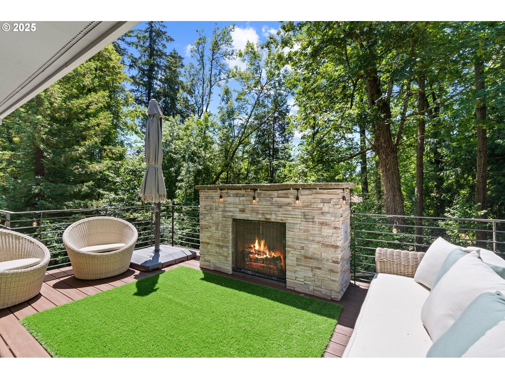 3425 Southwest 57th Avenue Portland, OR 97221 - Photo 20 of 33 a view of a couches in the deck under a umbrella