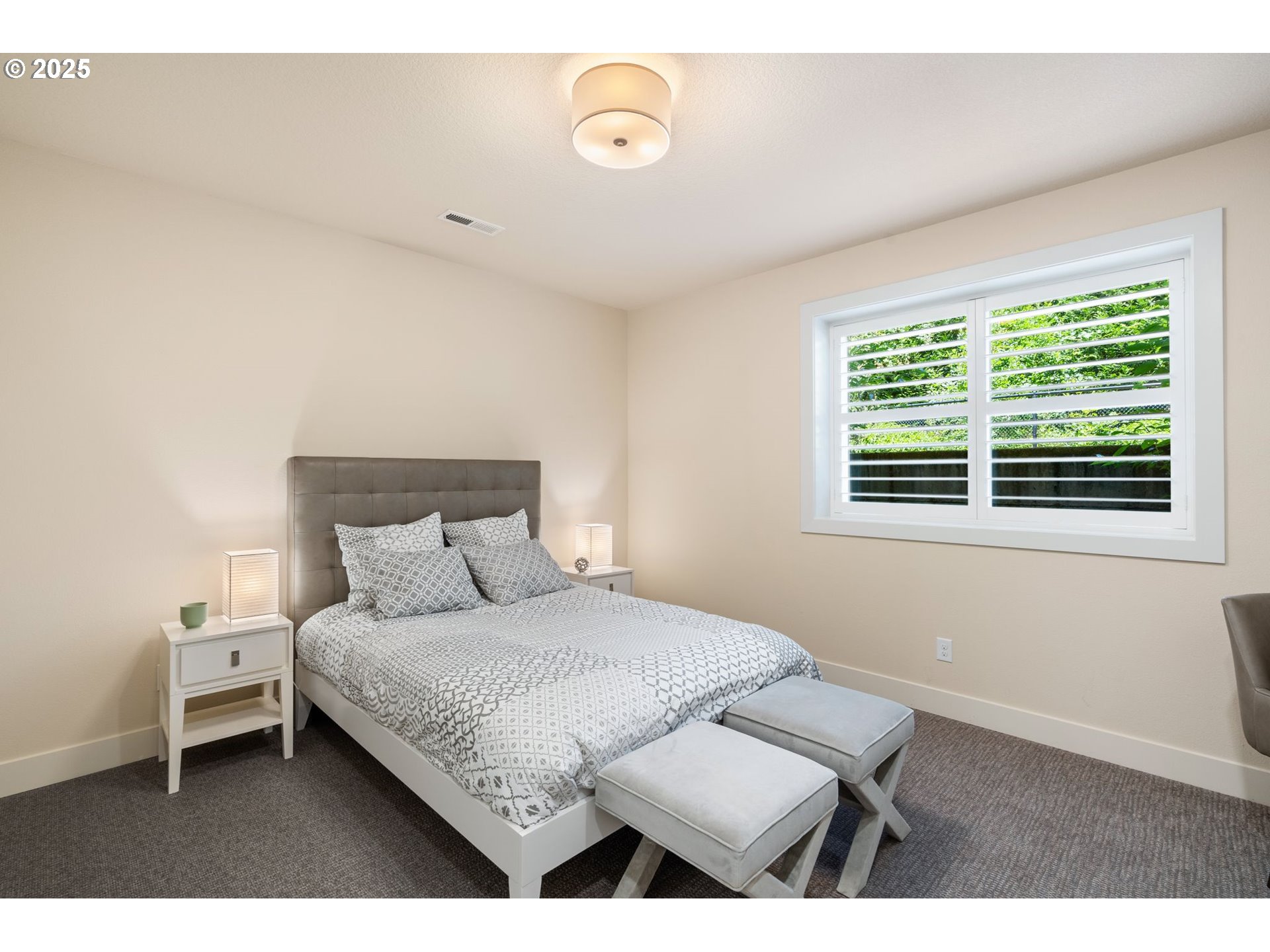 3425 Southwest 57th Avenue Portland, OR 97221 - Photo 23 of 33 a bedroom with a bed and a window