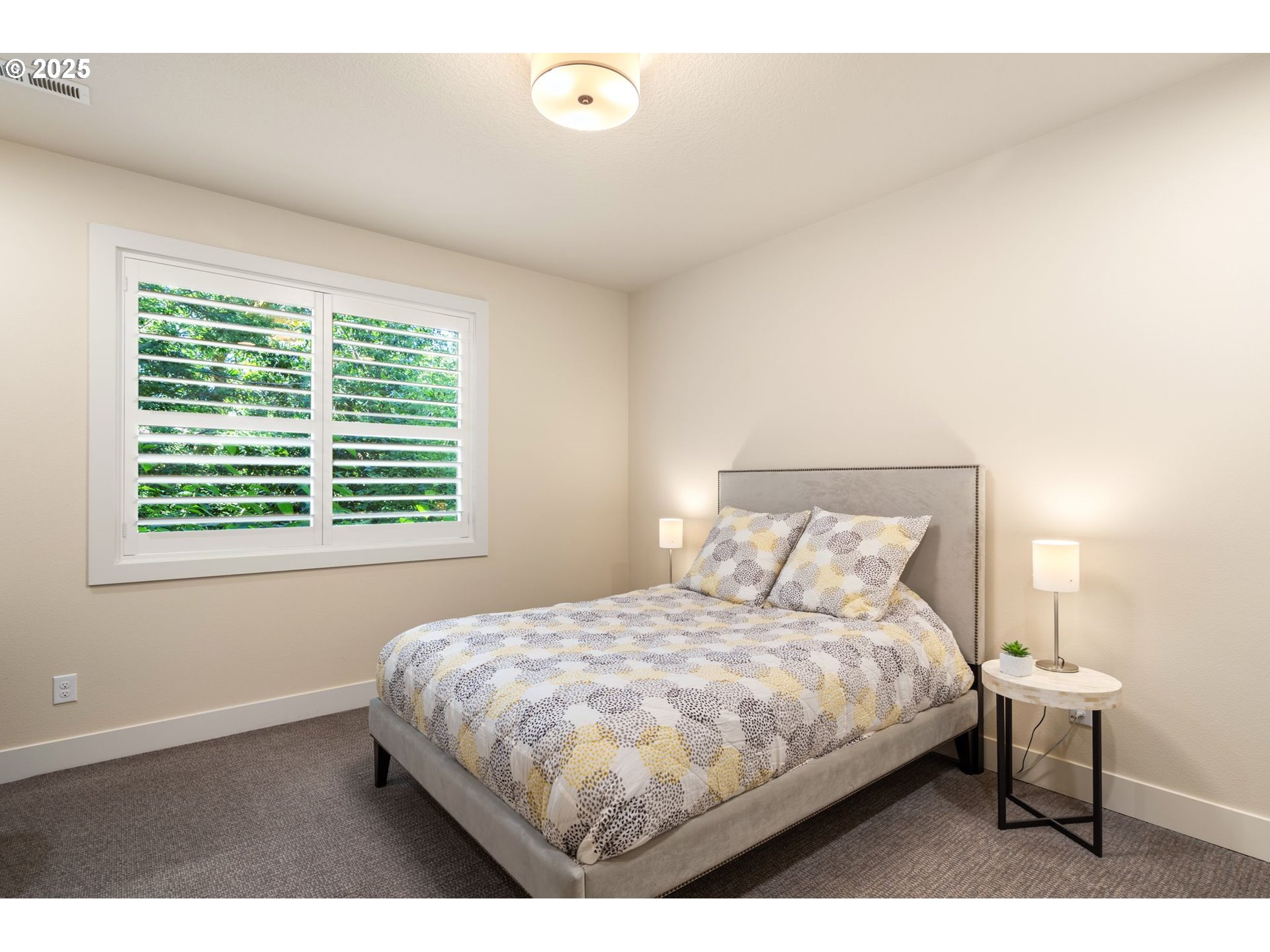 3425 Southwest 57th Avenue Portland, OR 97221 - Photo 26 of 33 a bedroom with a bed and a window