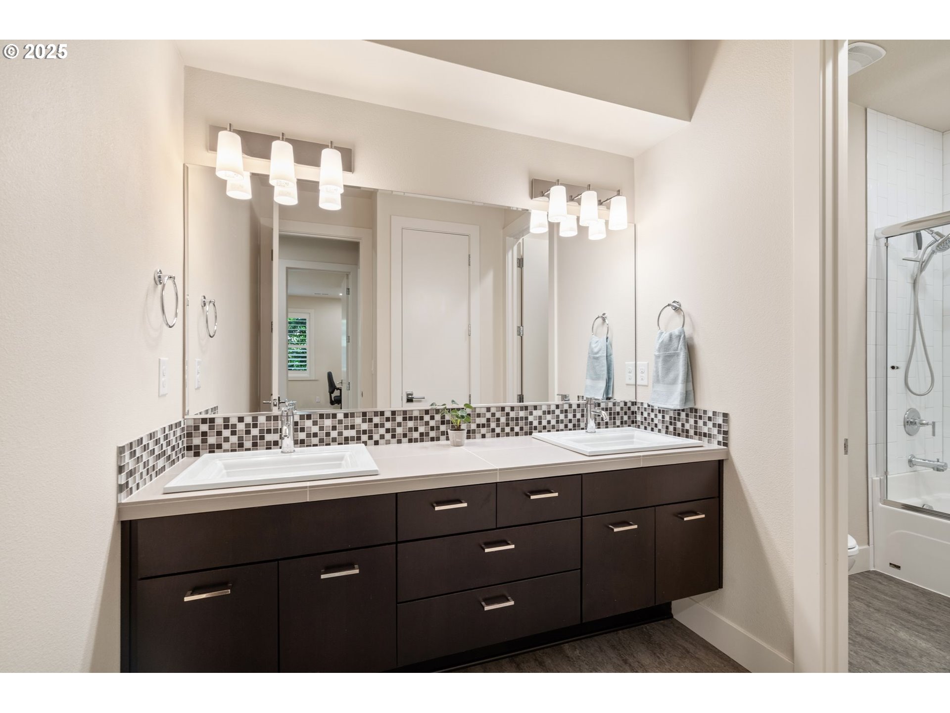 3425 Southwest 57th Avenue Portland, OR 97221 - Photo 28 of 33 a bathroom with a sink vanity and a mirror