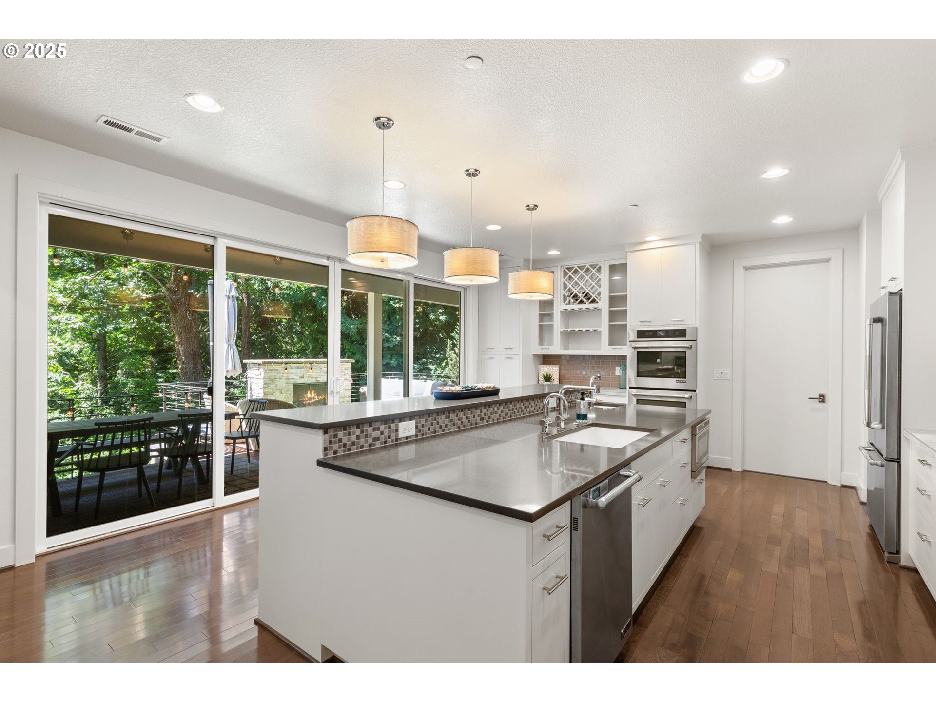 3425 Southwest 57th Avenue Portland, OR 97221 - Photo 5 of 33 a kitchen with stainless steel appliances granite countertop a sink and cabinets